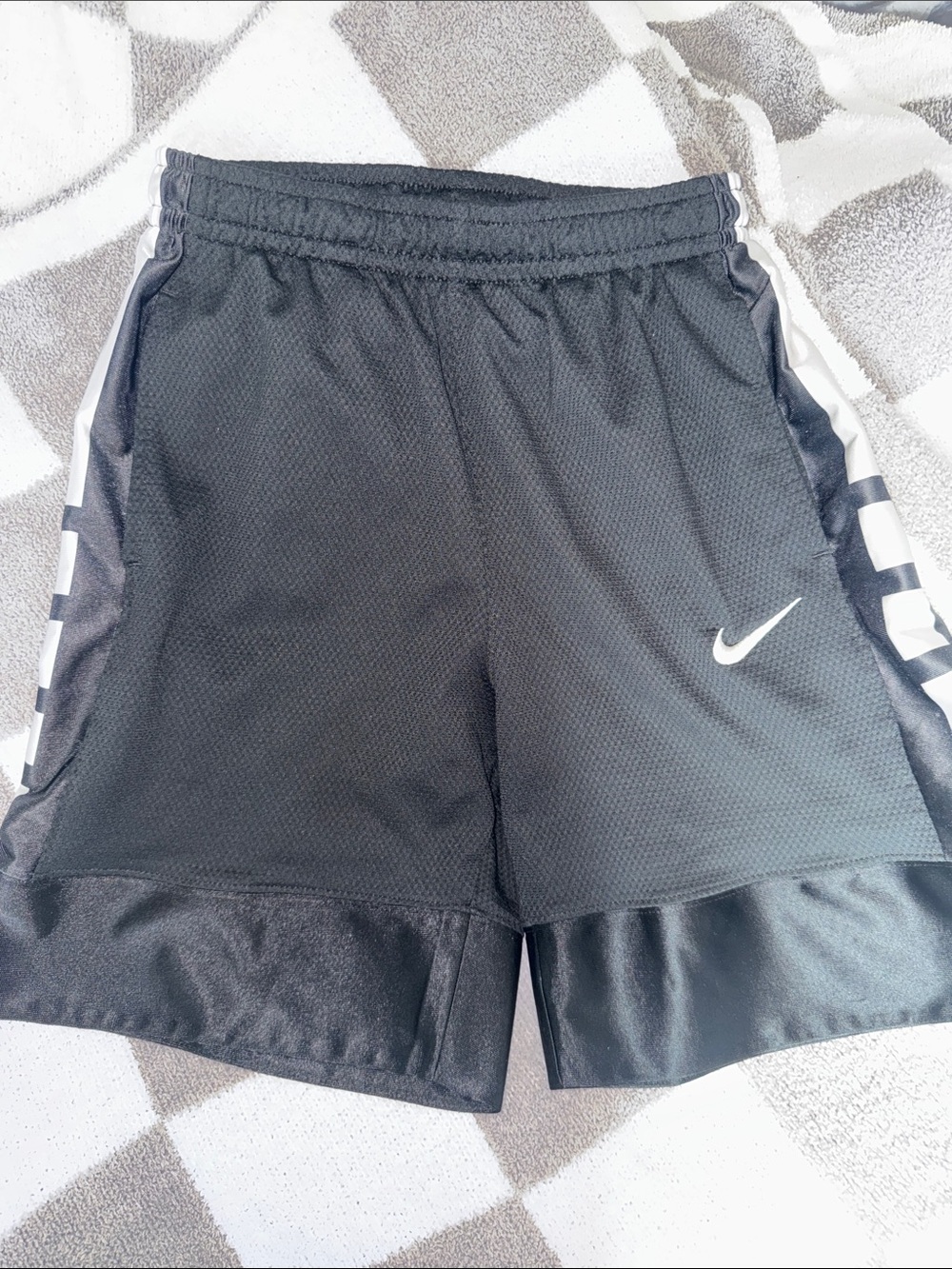 Youth Nike Black Athletic Shorts with White Swoosh and Side Panels